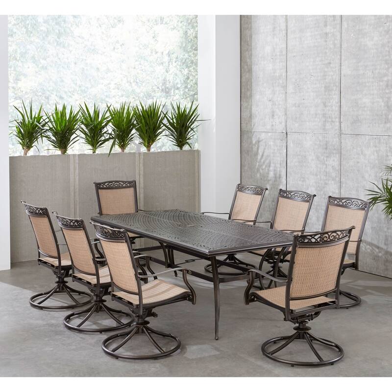 Hanover Fontana 9-Piece Outdoor Dining Set with 8 Sling Swivel Rockers and a 42-In. x 84-In. Cast-Top Table