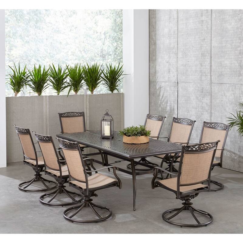 Hanover Fontana 9-Piece Outdoor Dining Set with 8 Sling Swivel Rockers and a 42-In. x 84-In. Cast-Top Table
