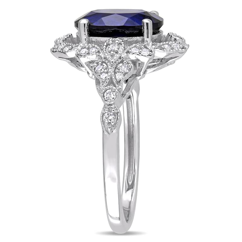 Miadora 10k White Gold Created Blue Sapphire and 1/5ct TDW Diamond Vintage Halo Cocktail Ring