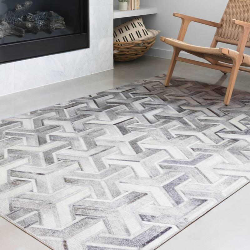 Alexander Home Davide Printed Faux Cowhide Area Rug