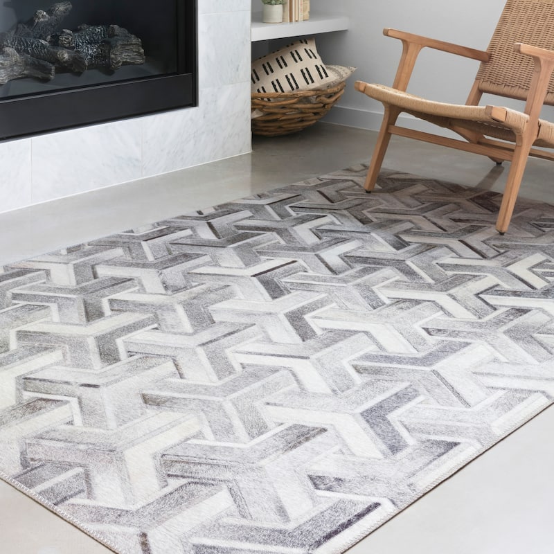 Alexander Home Davide Printed Faux Cowhide Area Rug