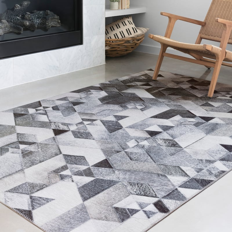 Alexander Home Davide Printed Faux Cowhide Area Rug