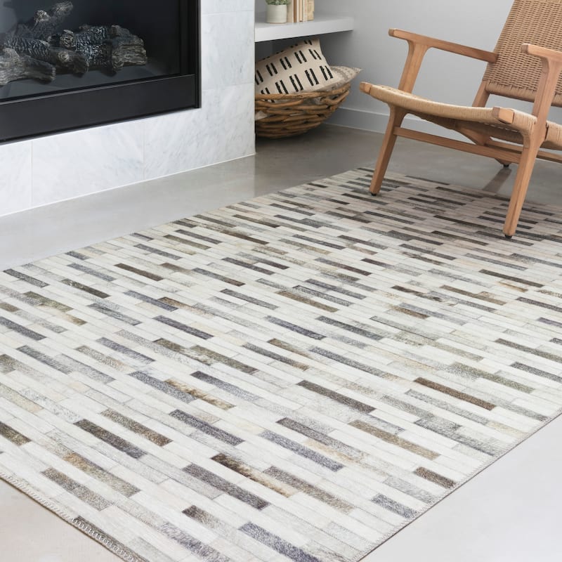 Alexander Home Davide Printed Faux Cowhide Area Rug