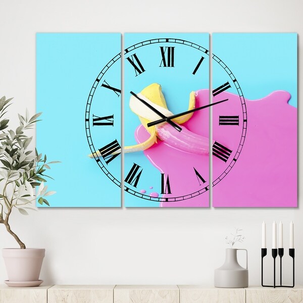 Designart 'Pink And Blue Banana' Large Modern Wall Clock - 3 Panels - 36 in. wide x 28 in. high - 3 Panels