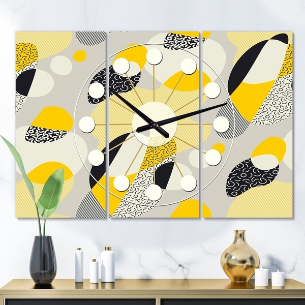 Designart 'Abstract Design Retro Pattern V' Oversized Mid-Century wall clock - 3 Panels - 36 in. wide x 28 in. high - 3 Panels. Opens flyout.