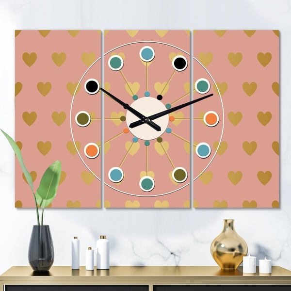 Designart 'Gold Hearts On Pink' Oversized Mid-Century wall clock - 3 Panels - 36 in. wide x 28 in. high - 3 Panels