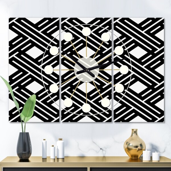 Designart 'Monochrome Geometric Pattern II' Oversized Mid-Century wall clock - 3 Panels - 36 in. wide x 28 in. high - 3 Panels. Opens flyout.