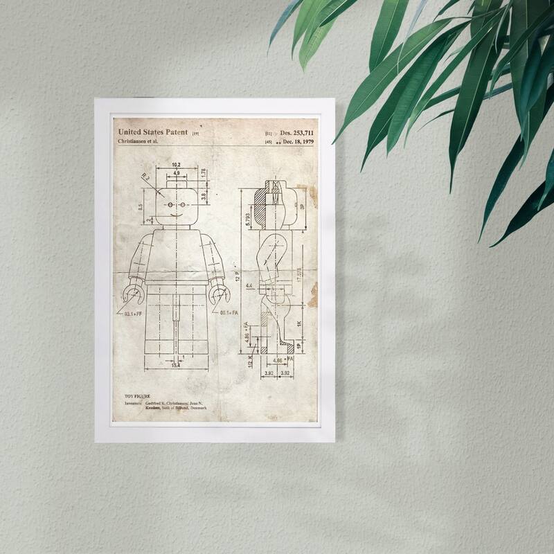 Wynwood Studio 'Lego Toy Figure 1979 Parchment' Symbols and Objects Framed Wall Art Print - White, Brown