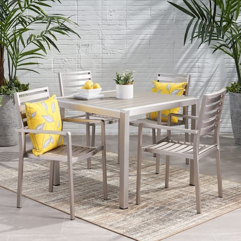 Cape Coral Outdoor Modern 4 Seater Aluminum Dining Set with Faux Wood Table Top by Christopher Knight Home