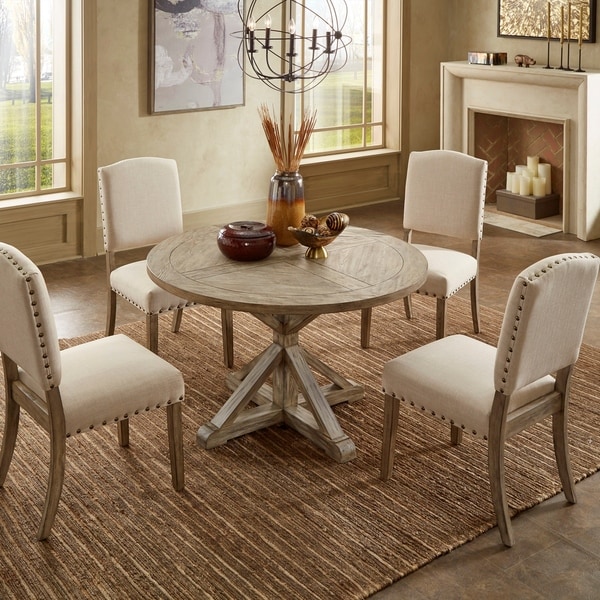 round oak dining table and grey chairs