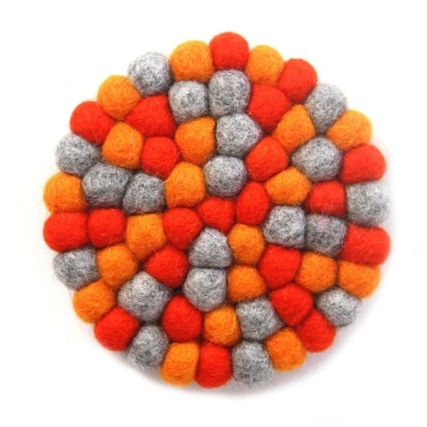 The Curated Nomad Southard Chakra Colors Felt Ball Trivet. Opens flyout.