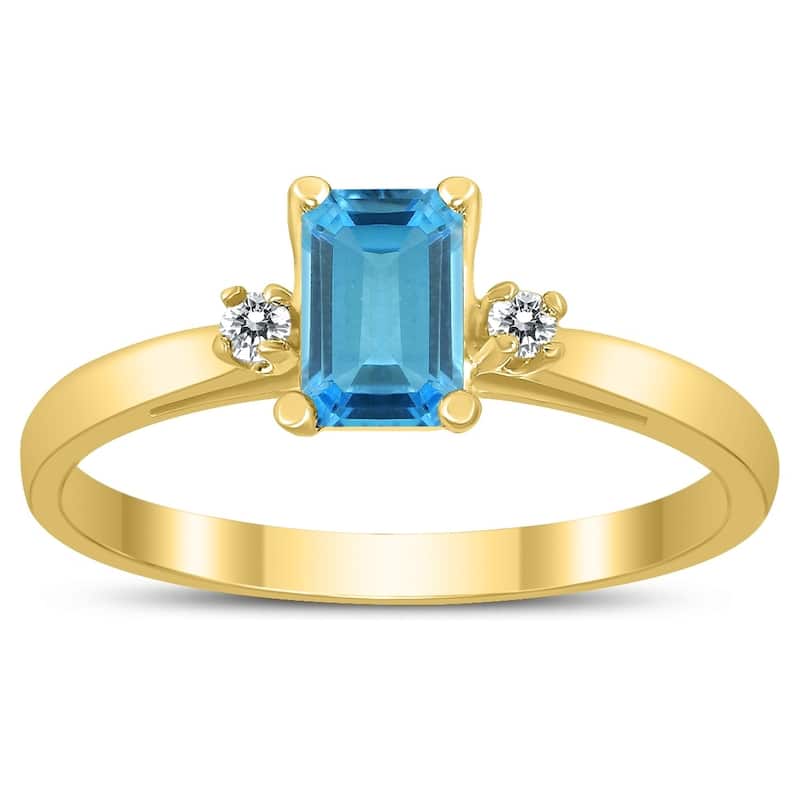 Emerald Cut 6X4MM Blue Topaz and Diamond Three Stone Ring in 10K Yellow Gold