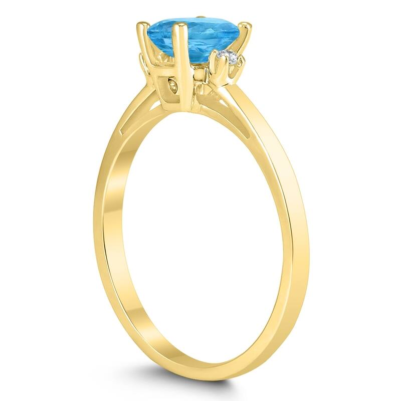 Emerald Cut 6X4MM Blue Topaz and Diamond Three Stone Ring in 10K Yellow Gold