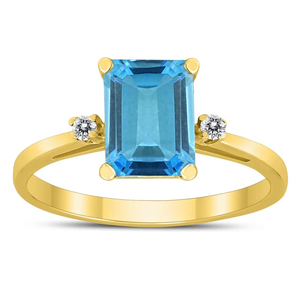 Emerald Cut 8X6MM Blue Topaz and Diamond Three Stone Ring in 10K Yellow Gold