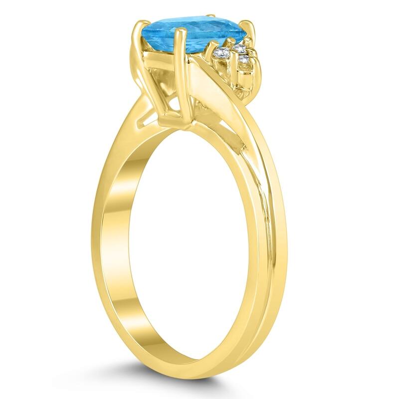 7X5MM Blue Topaz and Diamond Twist Ring in 10K Yellow Gold