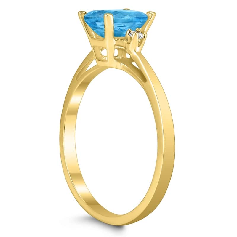 Emerald Cut 7X5MM Blue Topaz and Diamond Three Stone Ring in 10K Yellow Gold