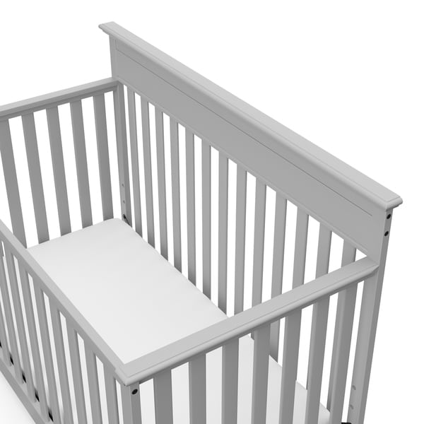 white crib and changing table set