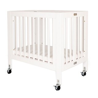 Foldable Wood and Metal Crib with Casters and Slatted Details, White