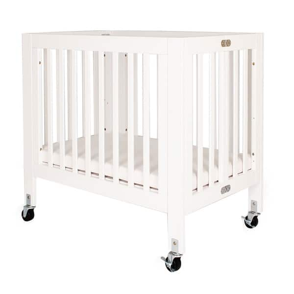 slide 2 of 5, Foldable Wood and Metal Crib with Casters and Slatted Details, White