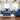 Roundhill Furniture Camero Fabric Pillowback Sofa and Loveseat Set in Navy Blue
