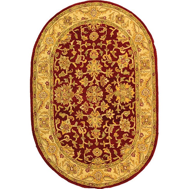 Handmade Antiquities Jewel Red/ Ivory Wool Rug (76 X 96 Oval)