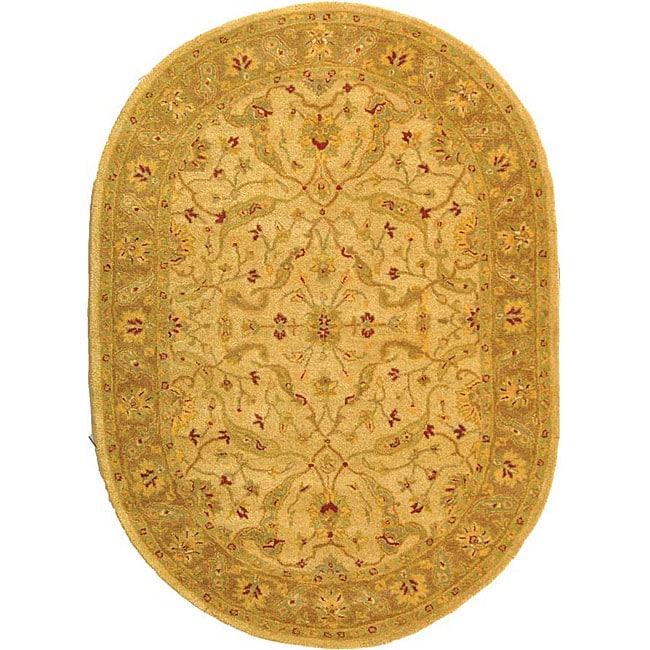 Handmade Treasure Ivory/ Brown Wool Rug (76 X 96 Oval)