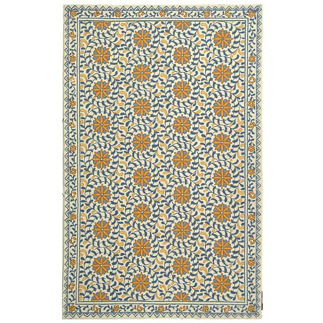 Hand hooked Majestic Ivory/ Blue Wool Rug (53 X 83) (IvoryPattern FloralMeasures 0.375 inch thickTip We recommend the use of a non skid pad to keep the rug in place on smooth surfaces.All rug sizes are approximate. Due to the difference of monitor color