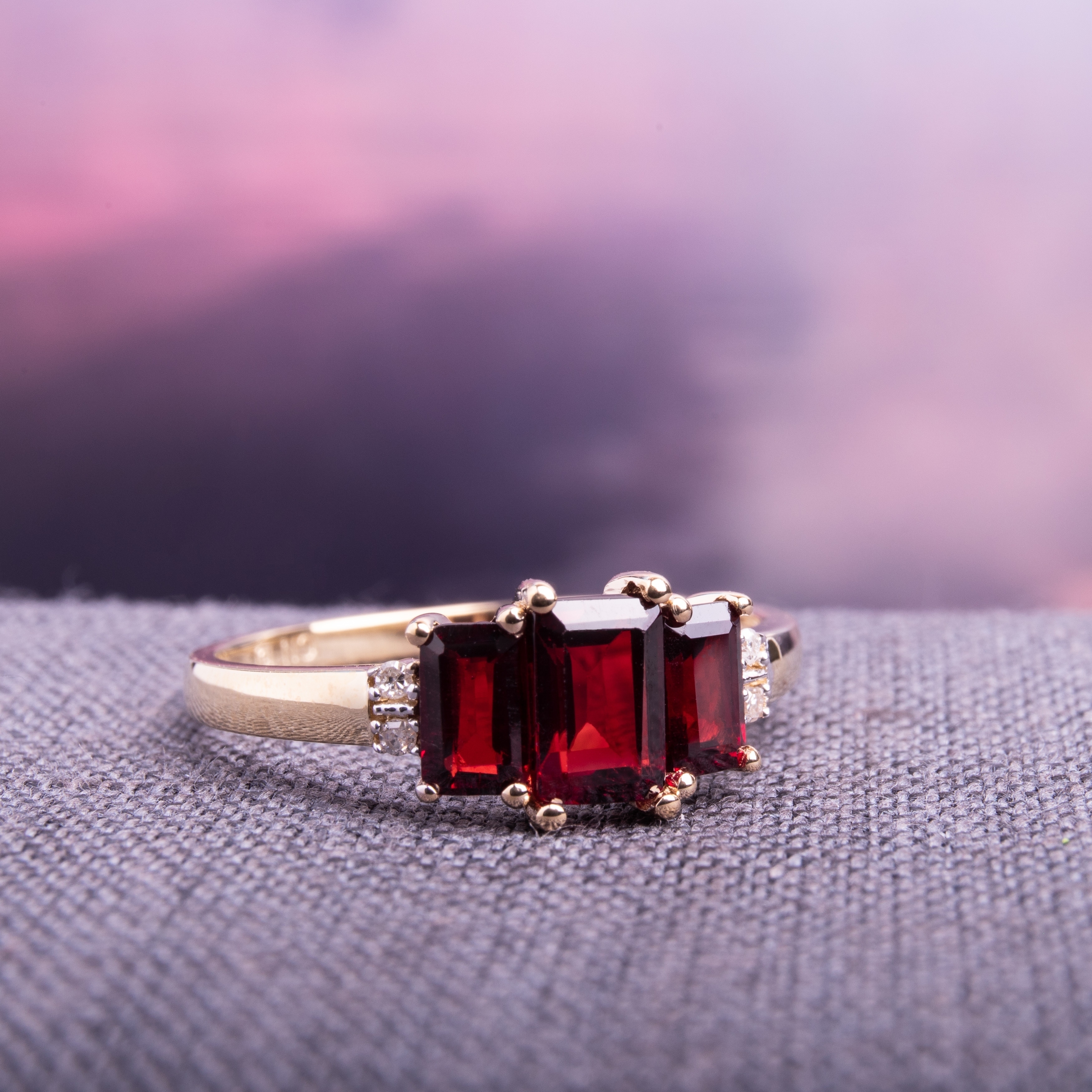 gold ring with garnet stone