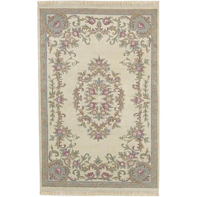 Hand knotted Aubusson Wool Rug (26 X 12) (IvoryPattern OrientalMeasures 0.625 inch thickTip We recommend the use of a non skid pad to keep the rug in place on smooth surfaces.All rug sizes are approximate. Due to the difference of monitor colors, some r