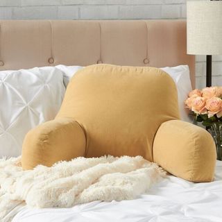 yellow bed rest pillow