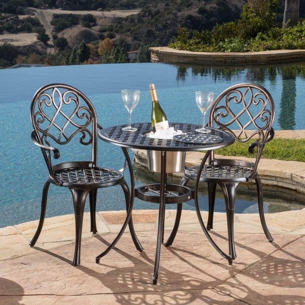 garden table and chairs with ice bucket