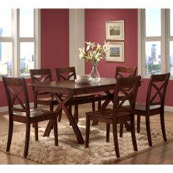 round wood dining table with four chairs