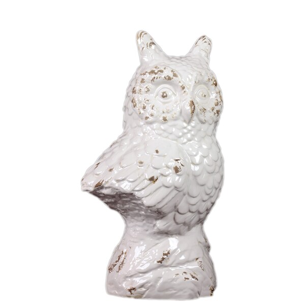 white ceramic owl figurine