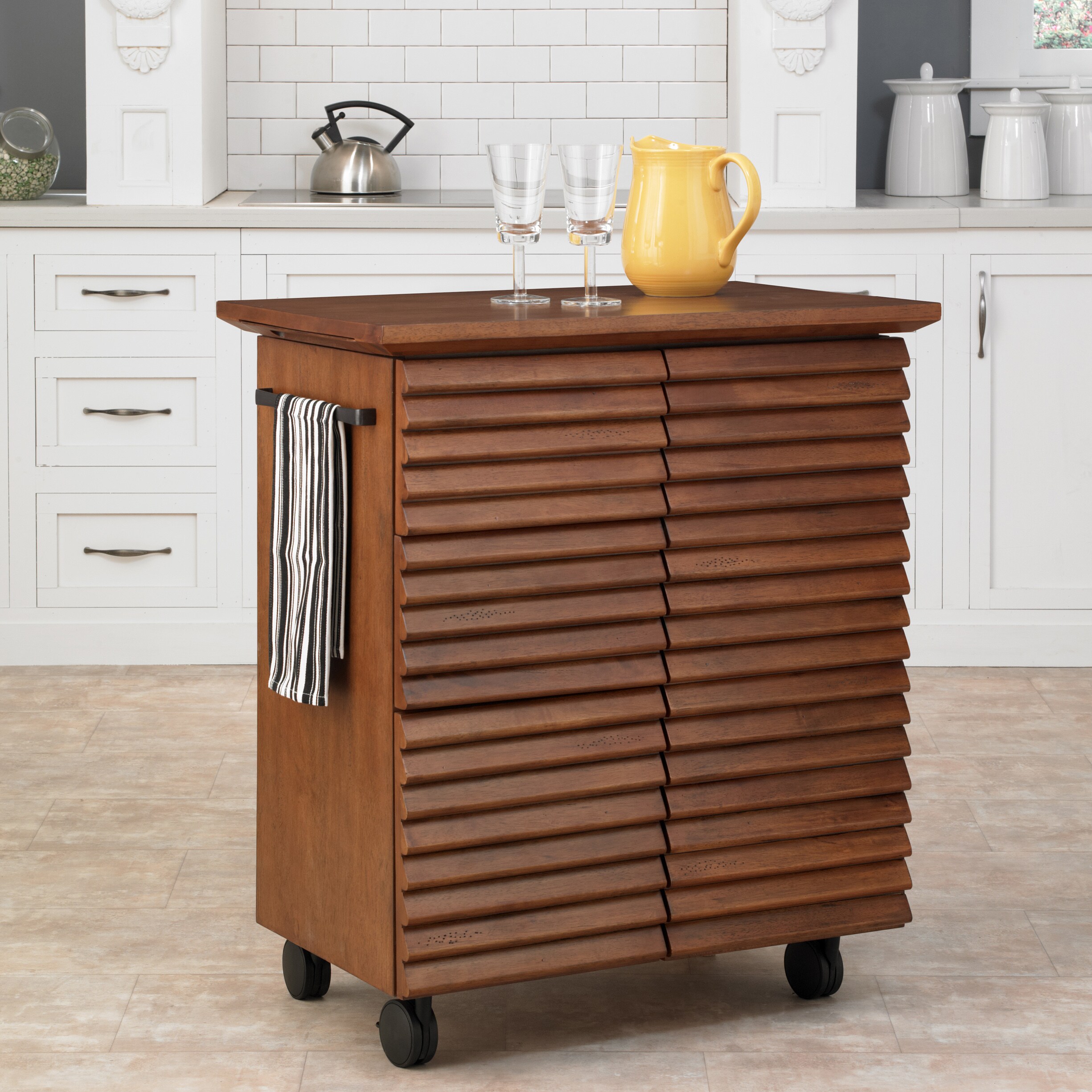 Cascade Louvred Kitchen Cart (ChestnutMaterials Hardwood solids and veneersFinish Warm oak Dimensions 36.25 inches high x 32 inches wide x 20.5 inches deepNumber of shelves One (1) Number of drawers/compartments Three (3) Model 5454 95Assembly requi
