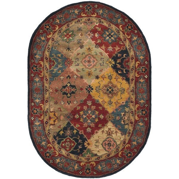 Safavieh Handmade Heritage Timeless Traditional Red Wool Rug - 7'6" x 9'6" Oval