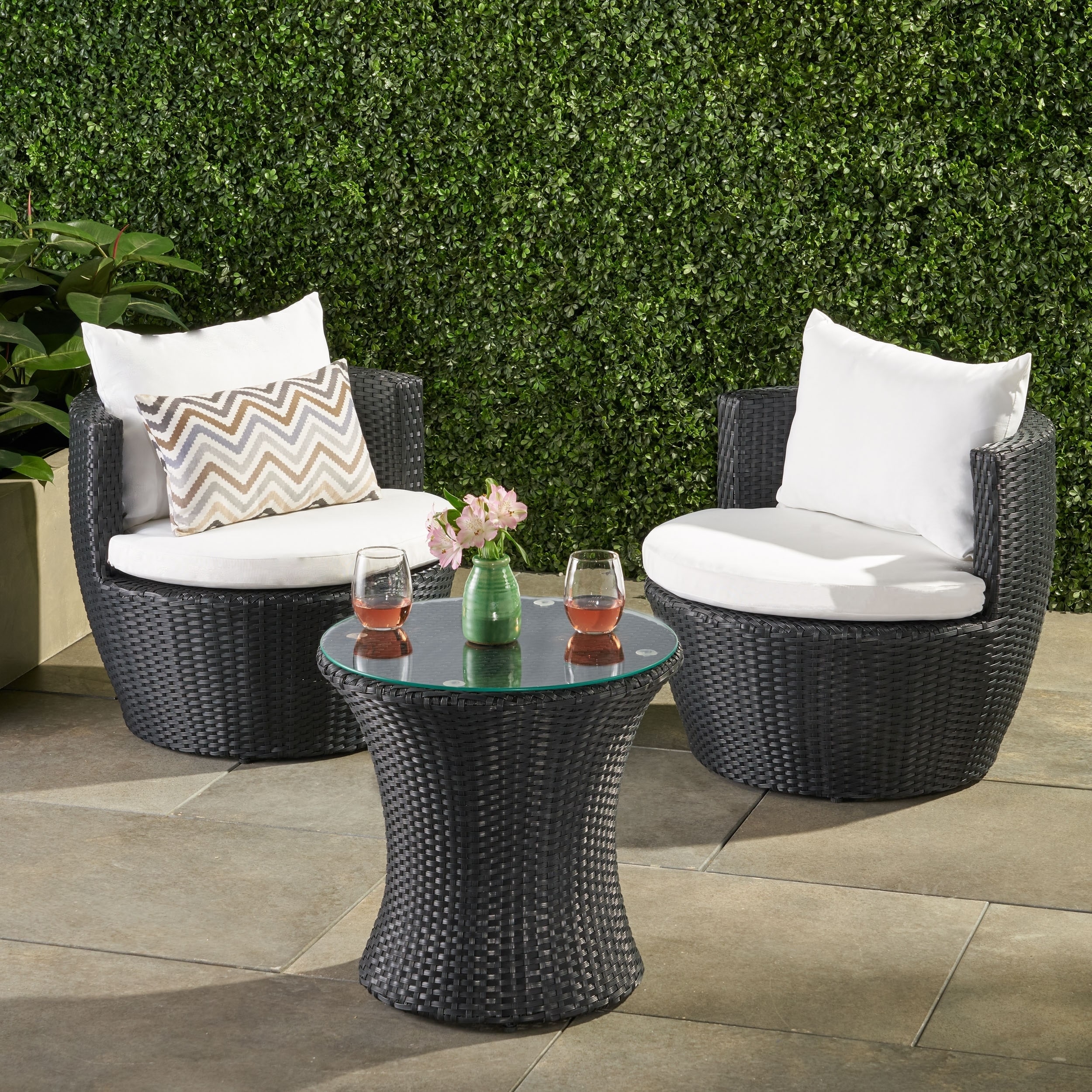 Christopher Knight Home Kono 3 piece Chat Set (Black with white cushionsNo assembly required, arrives ready to useSturdy constructionNeutral colors to match any outdoor decorIdeal for extra seating in your backyard areaChair Dimensions 23.62 inches high 