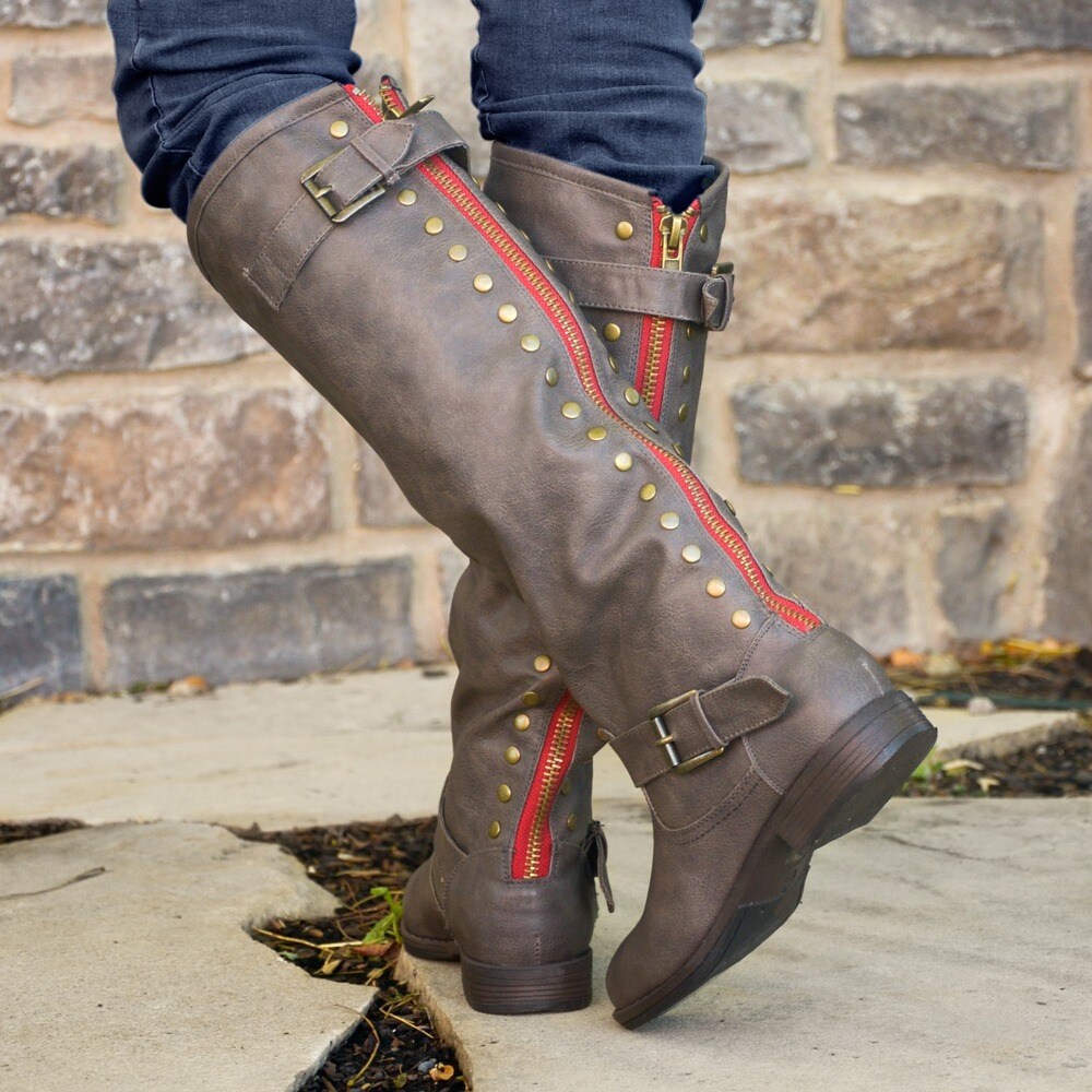 riding boots with red zipper