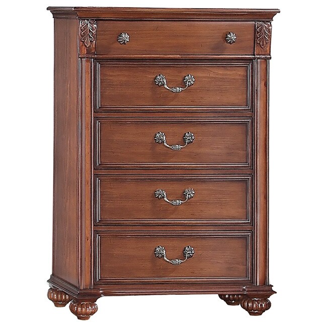 Berkley 5 drawer Chest (Hardwood solids and pine veneersFinish Warm pineDimensions 54 inches long x 38 inches wide x 17 inches deepWeight 143 poundsThe Berkley chest features 5 spacious drawers and is accented by the carved leaf design, antique brass r