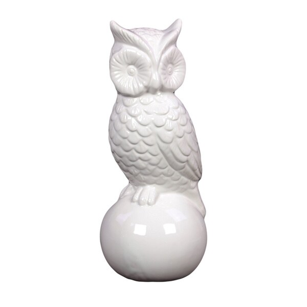 white ceramic owl figurine