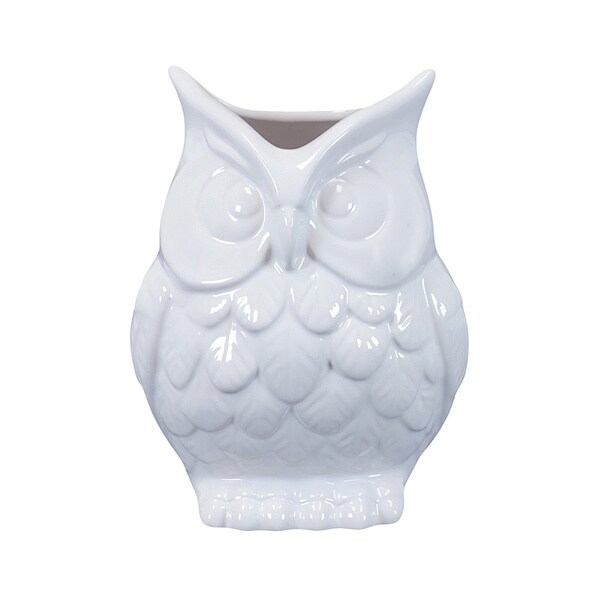 white ceramic owl figurine