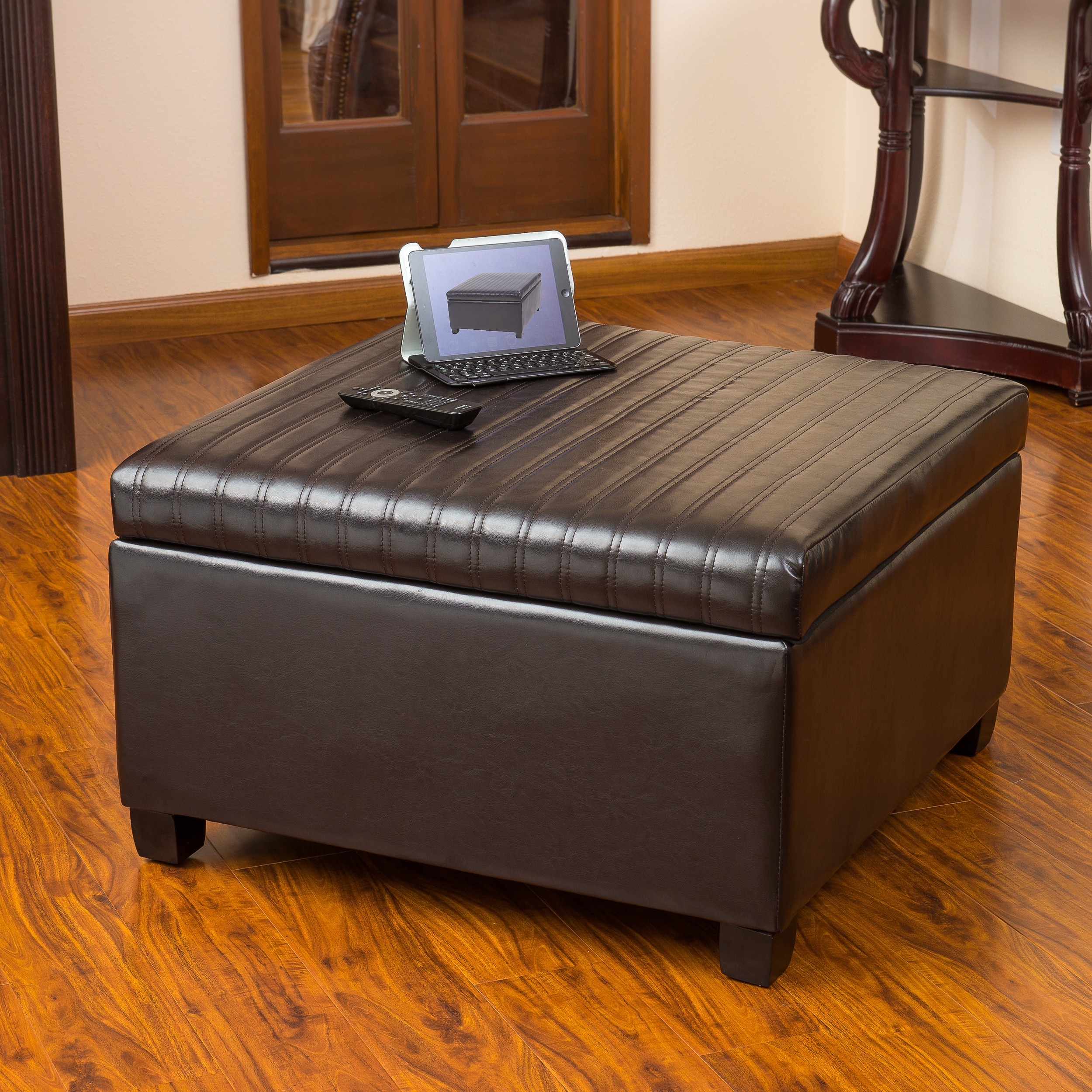Christopher Knight Home Cano Espresso Leather Storage Ottoman (EspressoFeatures Storage unitUse for extra seating, as a coffee tableSome assembly requiredDimensions 18.50 inches high x 31 inches wide x 31 inches deepInterior dimensions 11.5 inches high