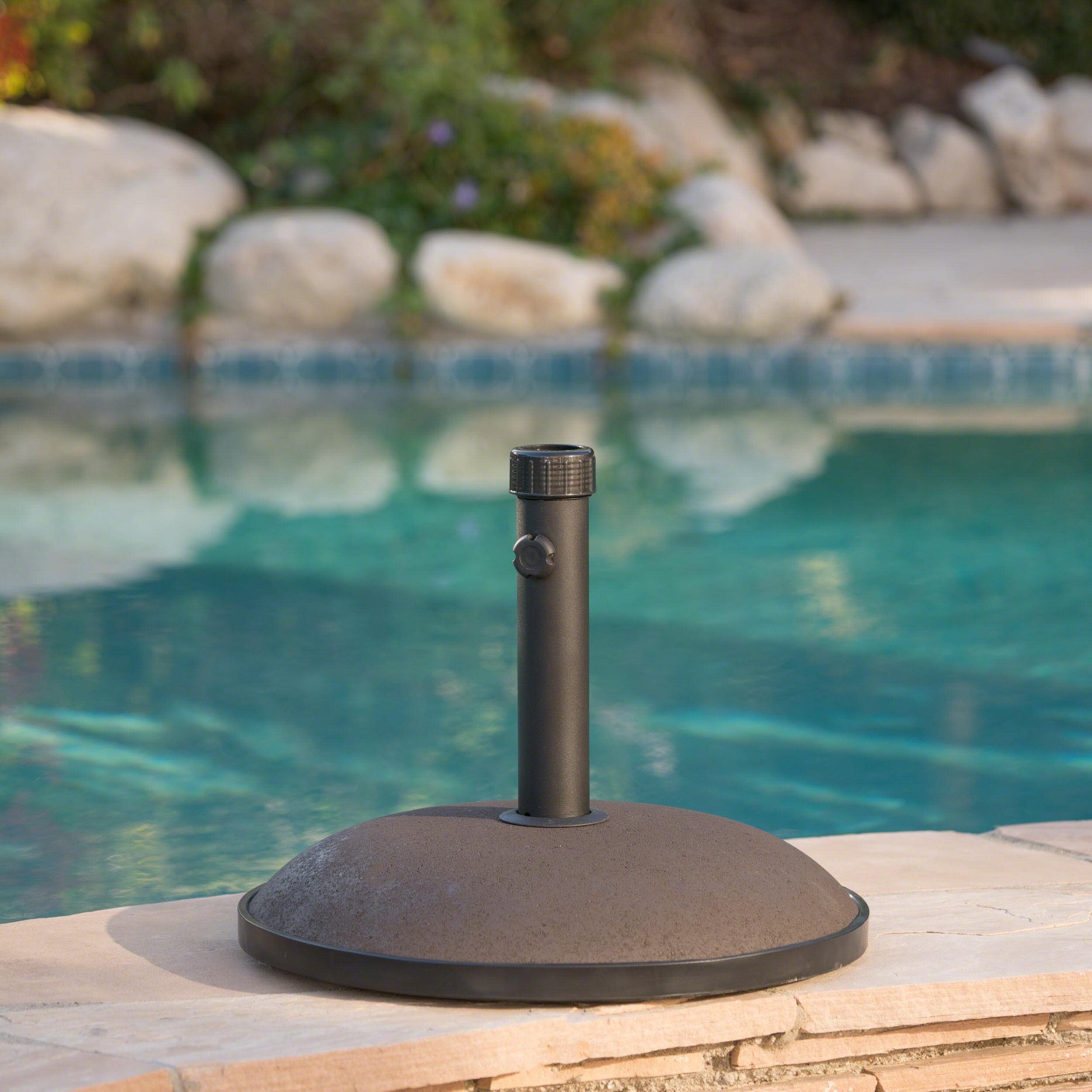 Christopher Knight Home Brown Umbrella Base (Brown66 pounds ensures a stable foundationAccomodates any outdoor patio umbrella size of up to 12 feetFeatures a tightening knob for a secure fitDimensions 3.95 inches high x 19.70 inches wide x 19.70 inches d