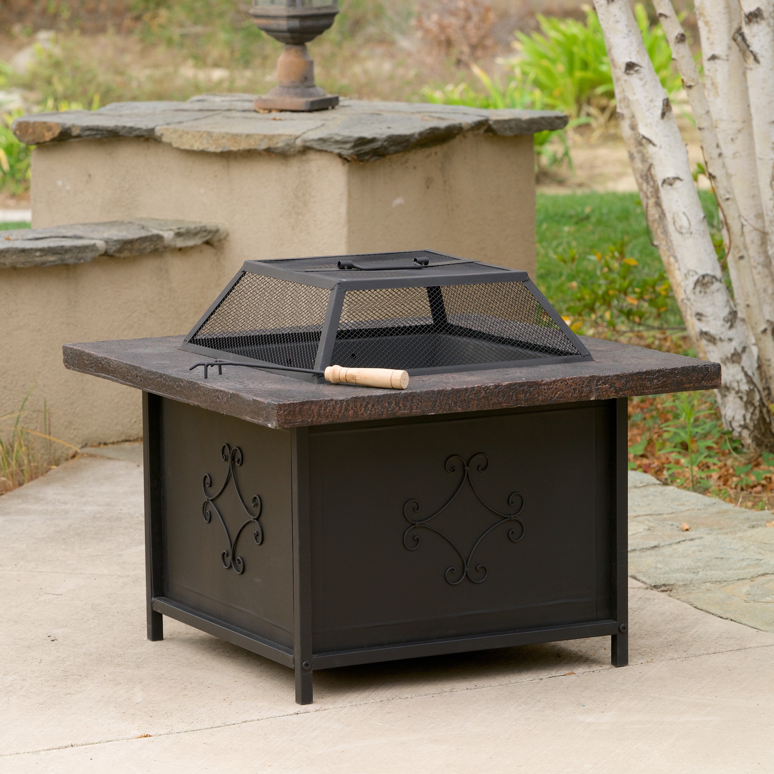 Christopher Knight Home Kerman Outdoor 30 Inch X 30 Inch Black Copper Fire Pit (Copper and blackFeatures black iron bottom reinforced with fiber glass cement and a weathered copper frame finishRemovable iron shieldFire pit tools includedWood burningSome a