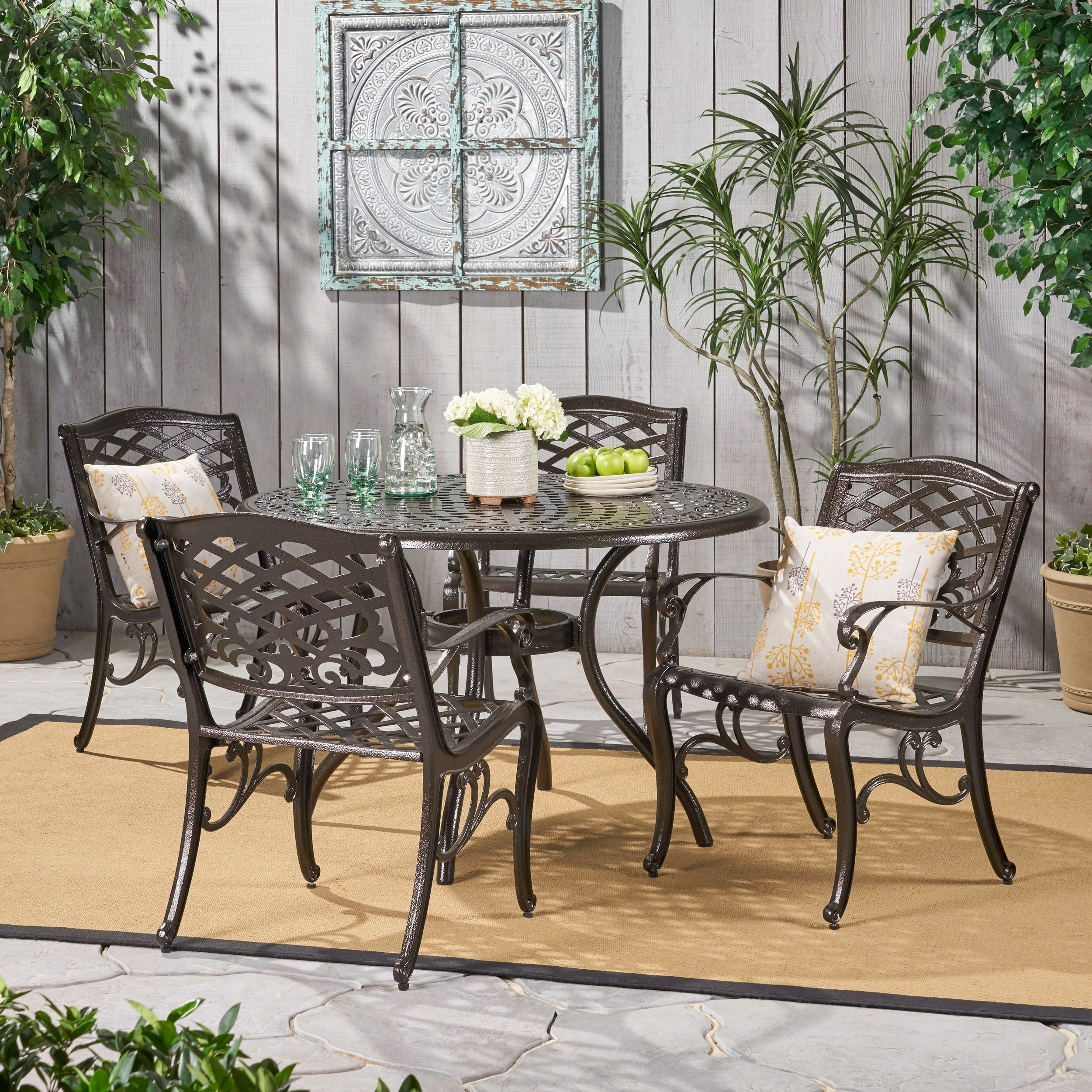 Christopher Knight Home Hallandale Sarasota 5 piece Cast Aluminum Bronze Outdoor Dining Set (BronzeFeatures mesh chairs and round table topSome assembly requiredSturdy constructionNeutral colors to match any outdoor decorIdeal for entertaining guests outd