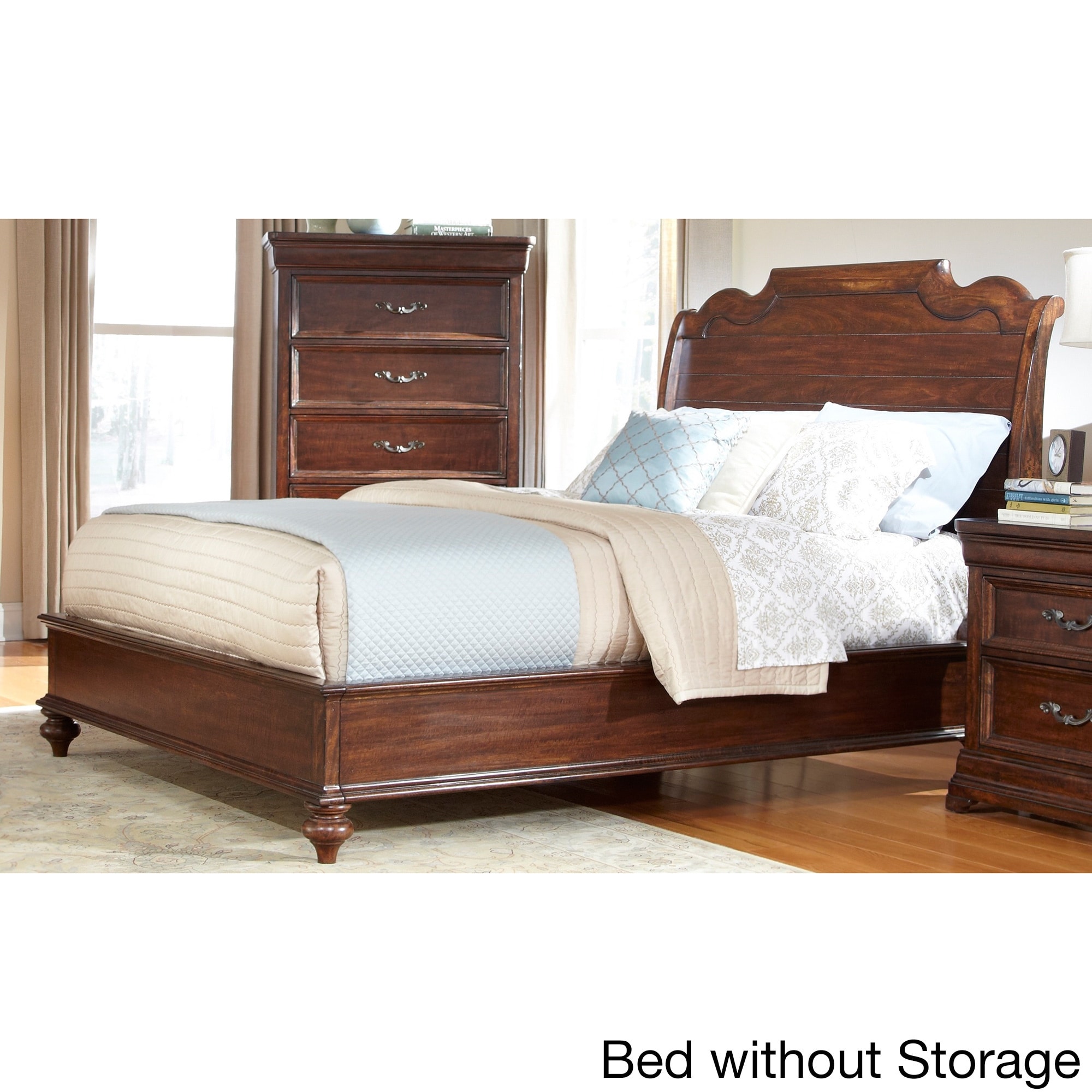 Senator Dark Brown Sleigh Bed With Optional Storage (Mango solids and veneersFinish Dark brownGently curved headboard with a uniquely shaped crownDecorative horizontal slat details on the headboardLow footboard and wide side rails add to the charm of thi