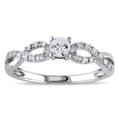 Miadora 10k White Gold Created White Sapphire and 1/10ct TDW Diamond Crossover Engagement Ring (H-I,