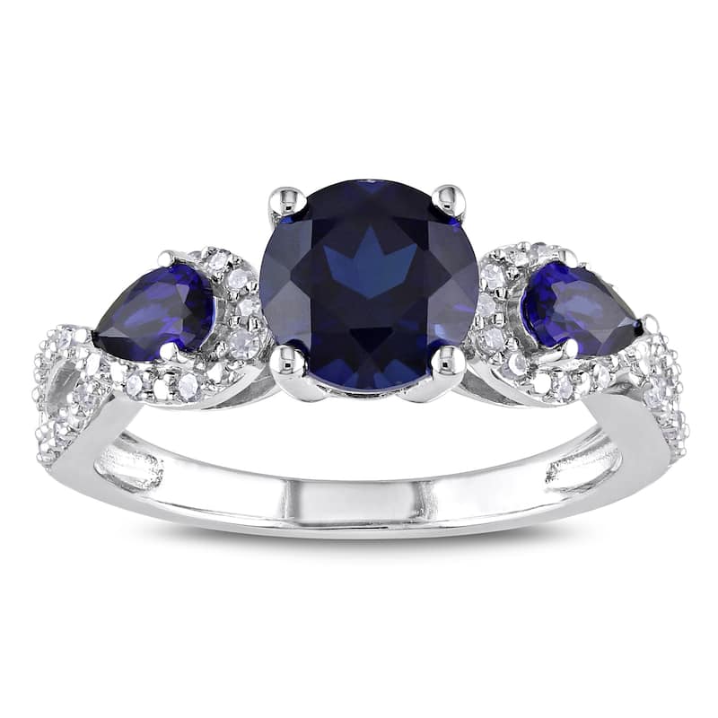 Miadora Sterling Silver Created Sapphire and 1/6ct TDW Diamond 3-Stone Crossover Ring - 5
