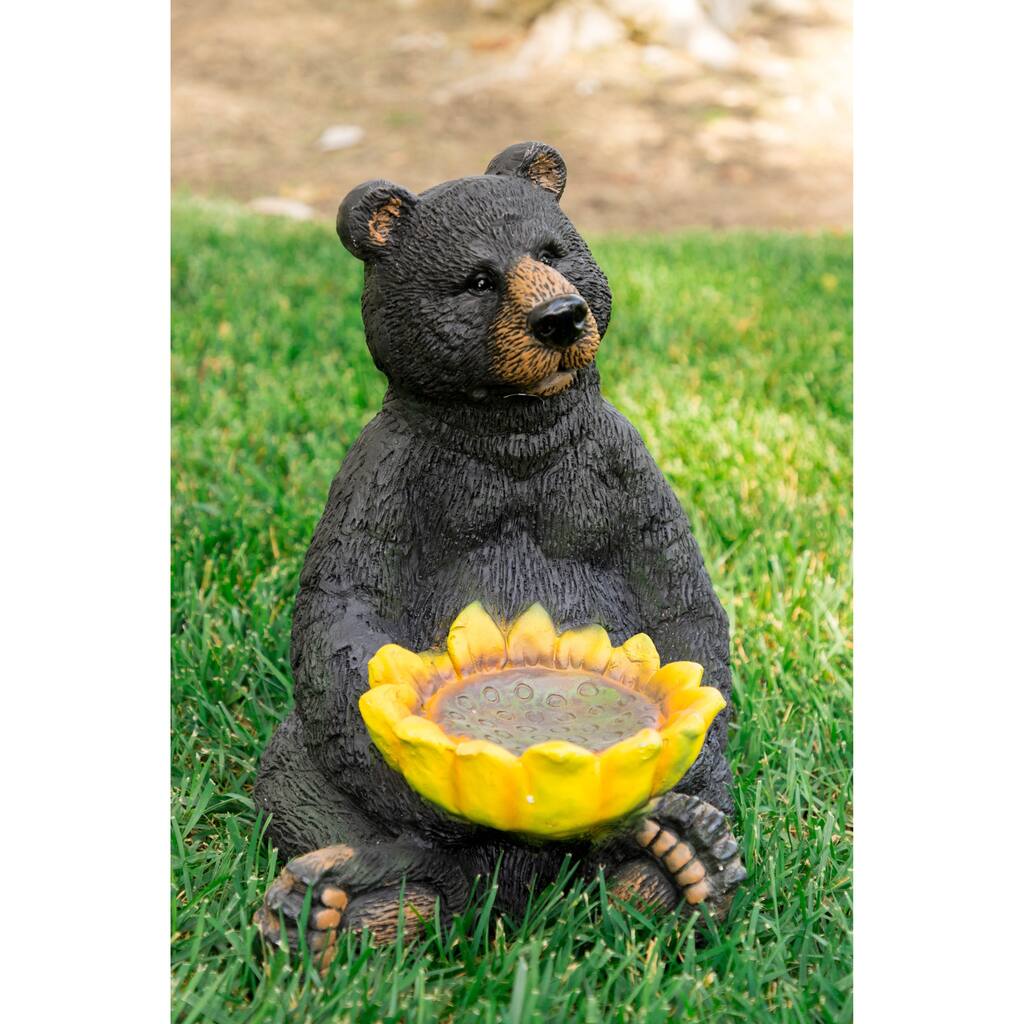 Black Bear Sitting with Sunflower Birdfeeder