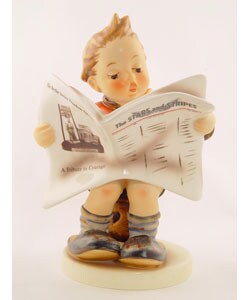 hummel boy reading newspaper