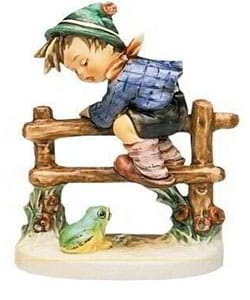 hummel boy on fence with frog